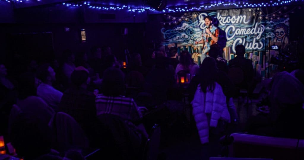 Comedian on stage at Backroom Comedy Club
