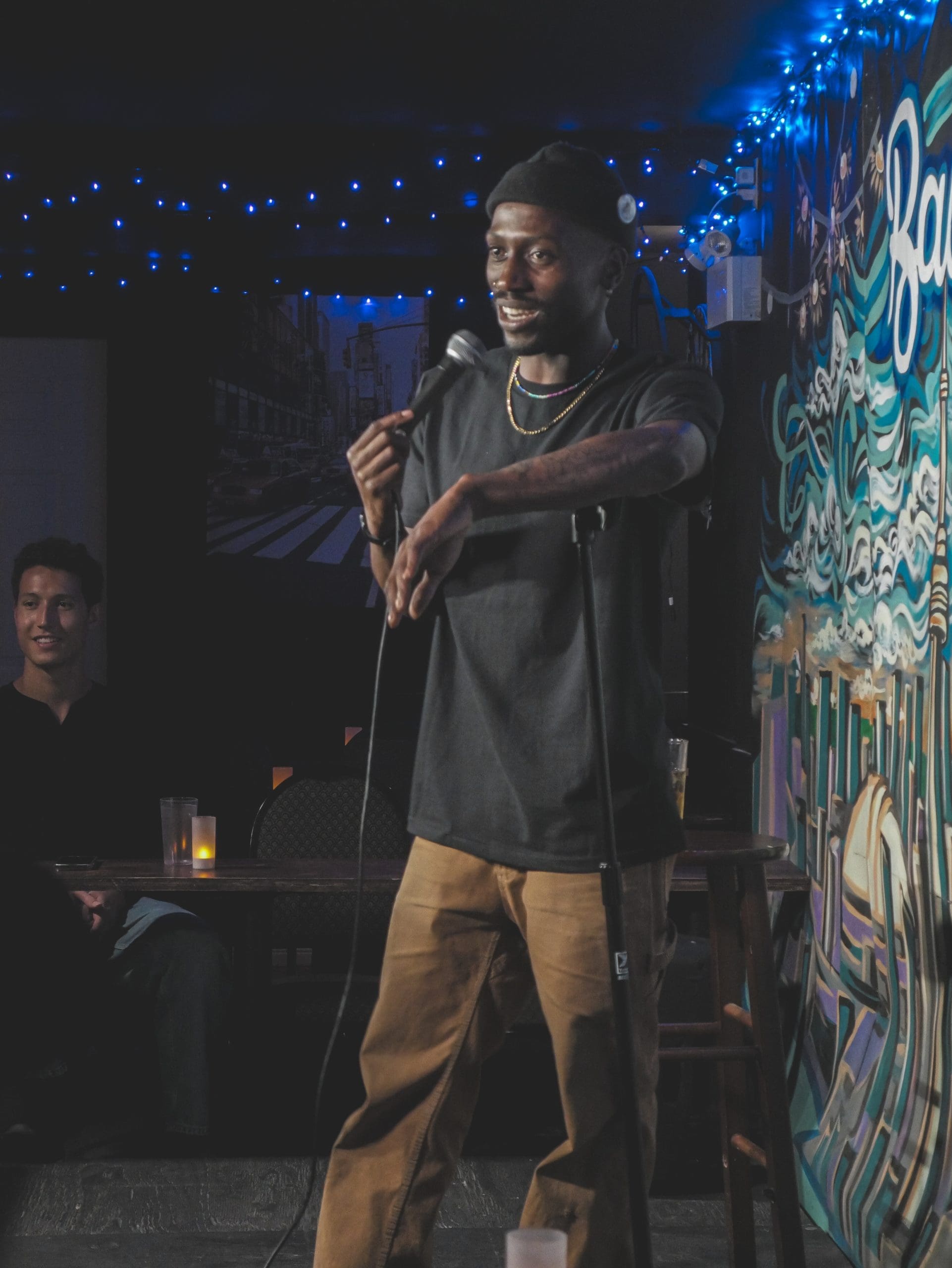 Comic on stage at Backroom Comedy Club
