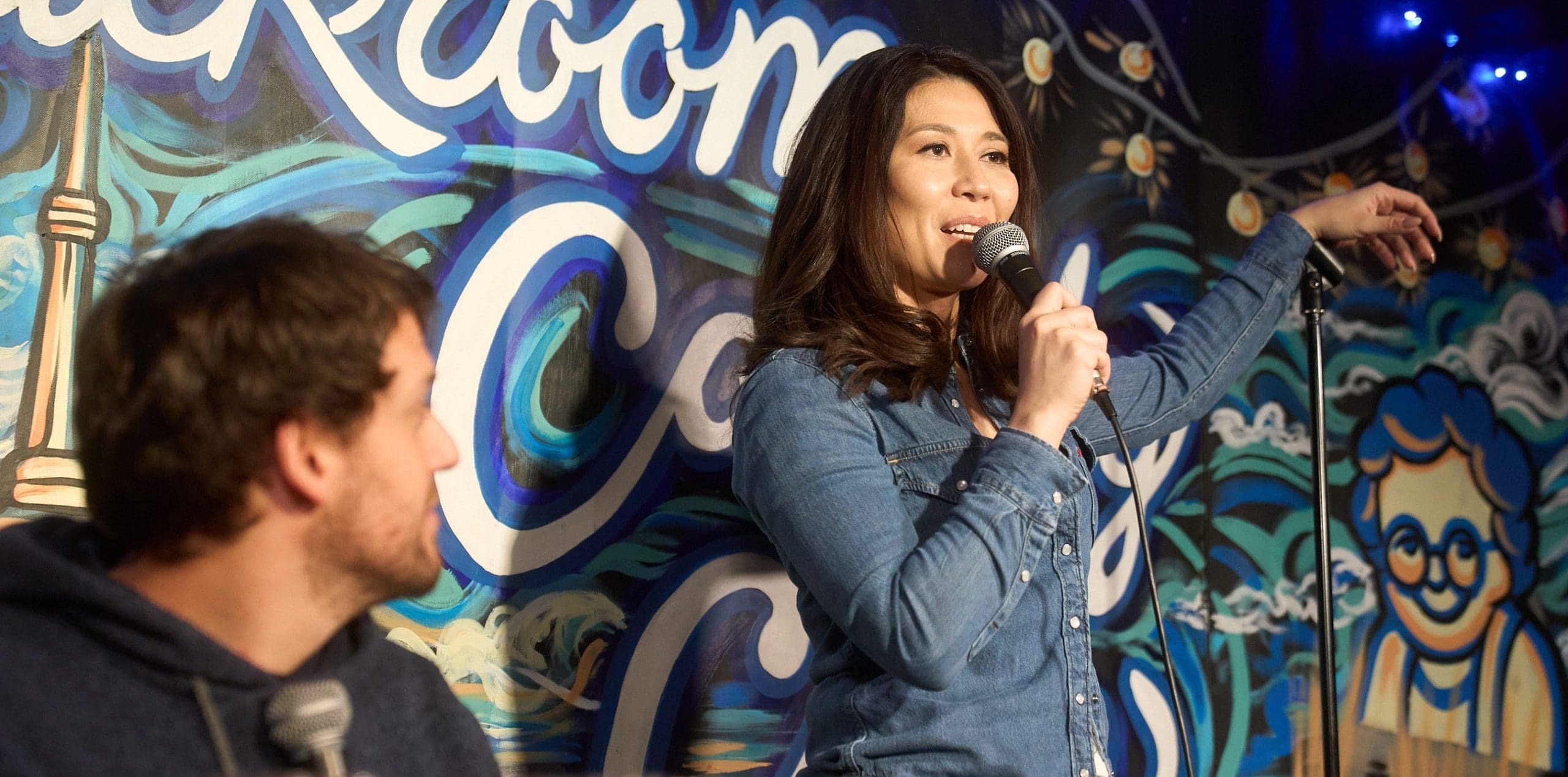 Audience member watching comic at Backroom Comedy Club
