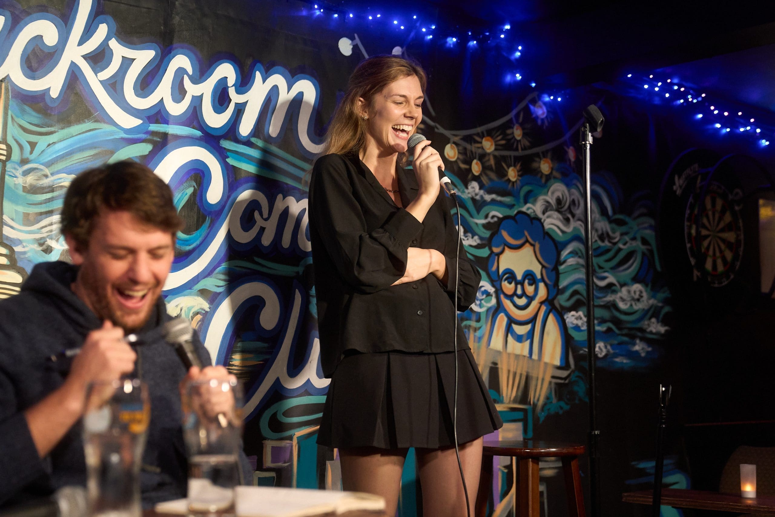 Man Laughing by Stage at Backroom Comedy Club