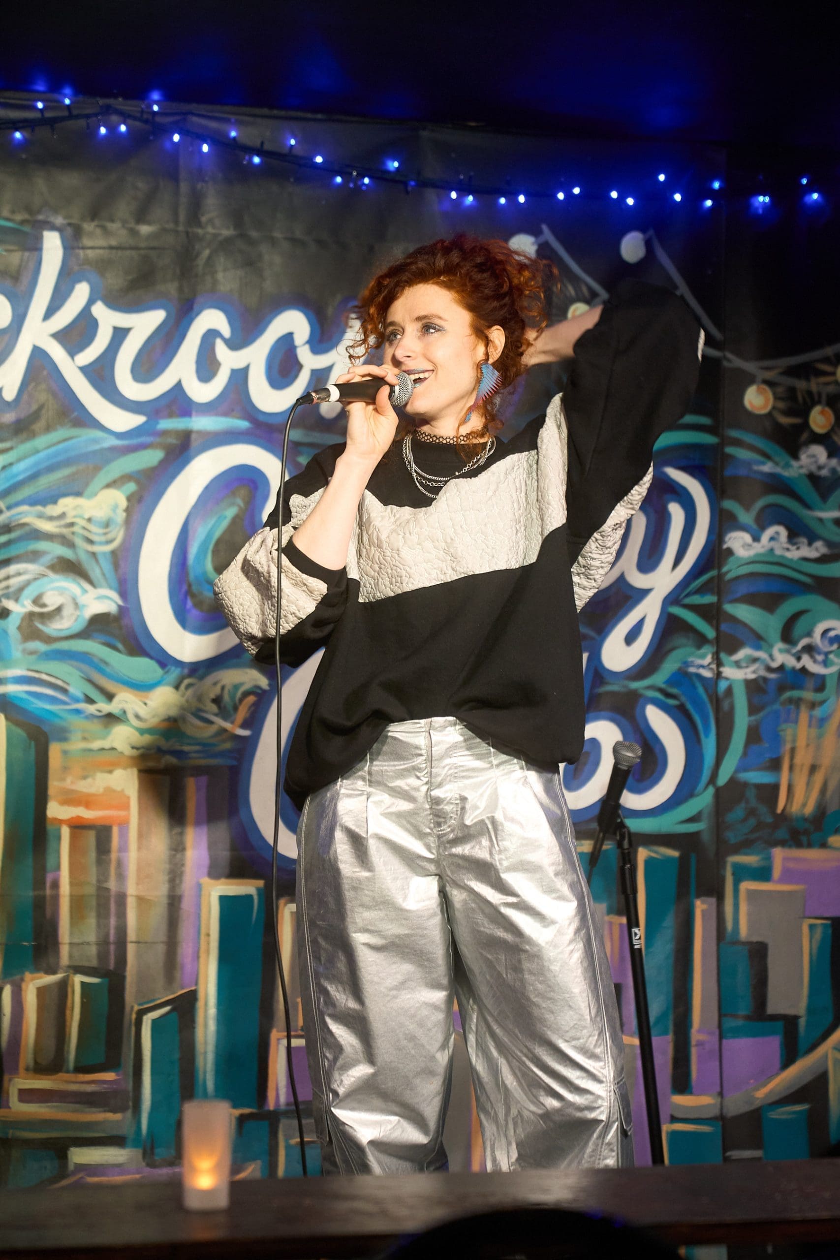 Comic on stage at Backroom Comedy Club